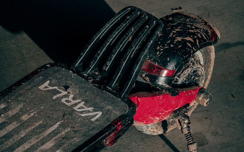 black and red motorcycle on gray concrete floor