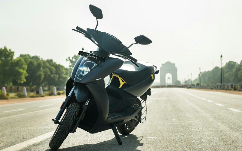 a scooter is parked on the side of the road